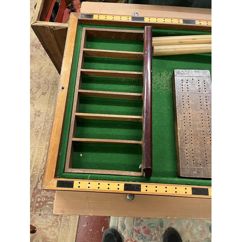 144 - Collection of sporting equipment to include dartboard, bagatelle board etc