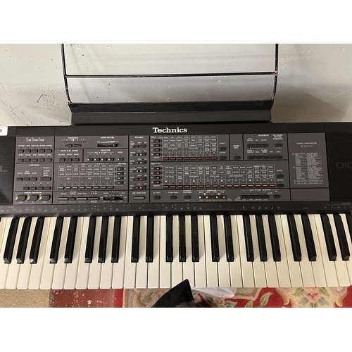 189 - Technics SX-K700 PMC electronic keyboard together with stand, foot pedal, carry case and book