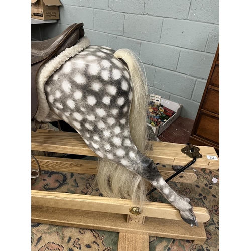 218 - Fine quality rocking horse with leather saddle and real horse hair in excellent condition