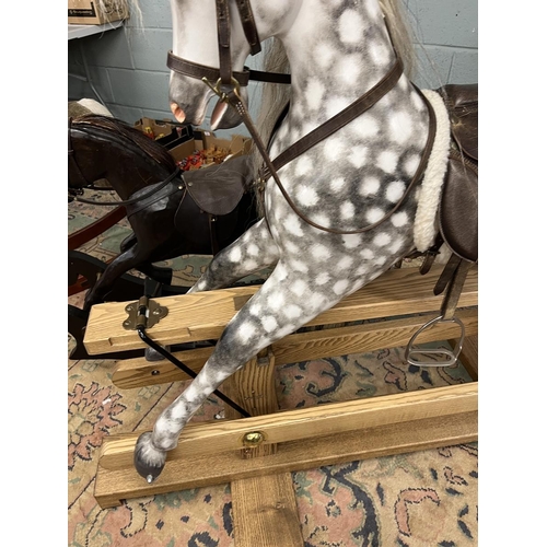 218 - Fine quality rocking horse with leather saddle and real horse hair in excellent condition