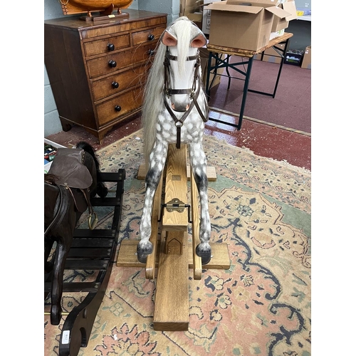 218 - Fine quality rocking horse with leather saddle and real horse hair in excellent condition