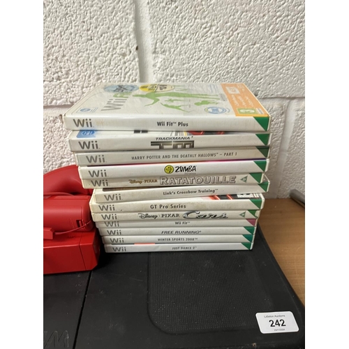 242 - Nintendo Wii games console together with Wii Fit, games and accessories