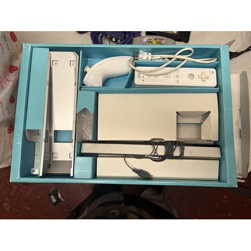 247 - Nintendo Wii in original box with good selection of games