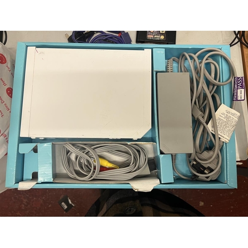 247 - Nintendo Wii in original box with good selection of games