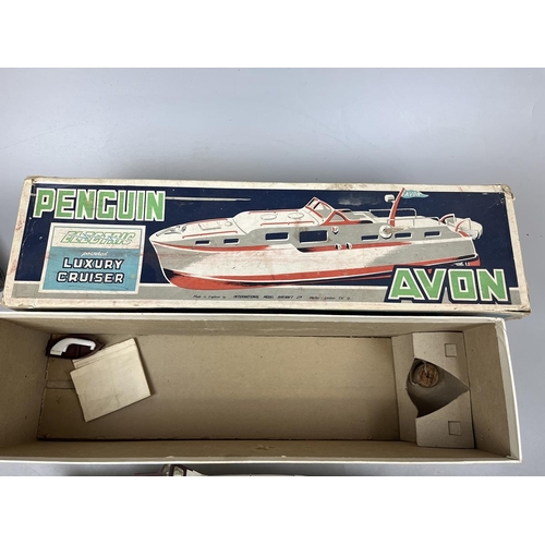 451 - Penguin super scale model Avon 17 inch battery powered boat in original box together with a pond yac... 