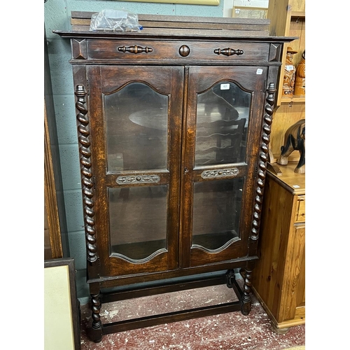 451 - Carved oak glazed bookcase