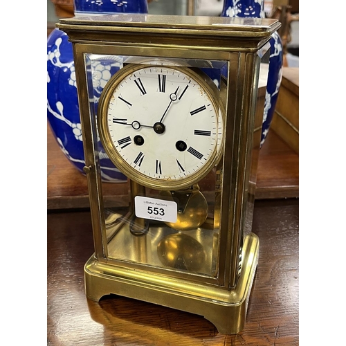 553 - Brass and glass mantle clock with pendulum and key