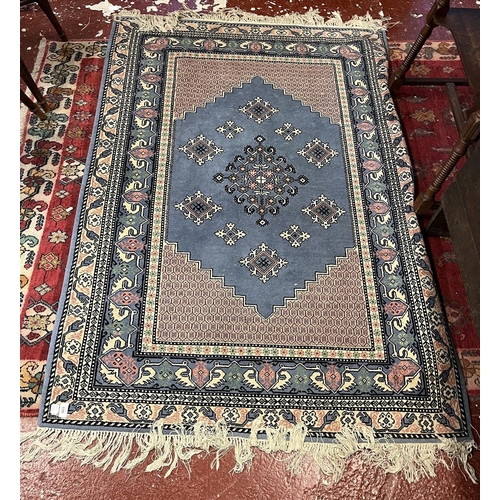 699 - Blue patterned rug - Approx 190cm x 122cm