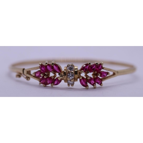 102 - 10ct gold ruby & white sapphire set bangle