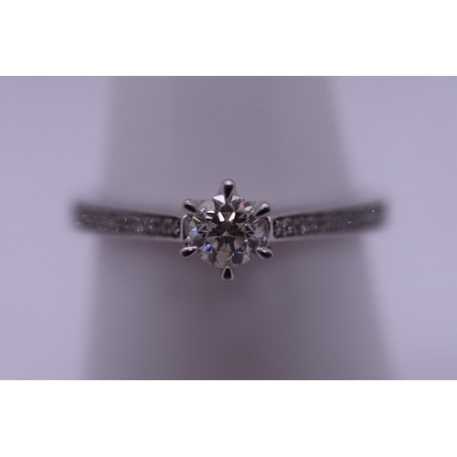 117 - 9ct white gold diamond solitaire ring - Size O