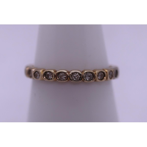 133 - 14ct gold stone set eternity ring