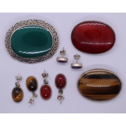 144 - Collection of jewellery including brooches, earrings, tigers eye, carnelian etc