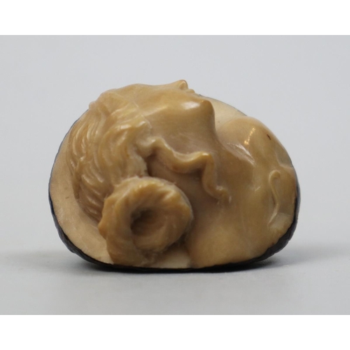 254 - Tagua nut (or ‘Tree Ivory’) carving in the figure of a woman