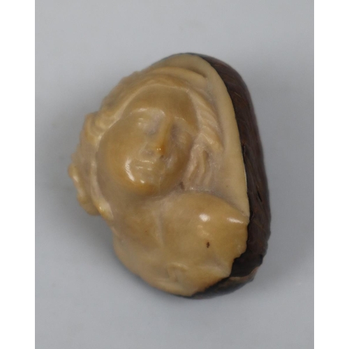 254 - Tagua nut (or ‘Tree Ivory’) carving in the figure of a woman