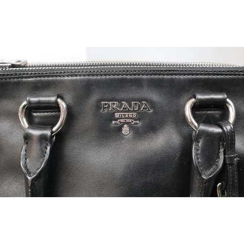 257 - Genuine Prada handbag with original dust bag and C.O.A