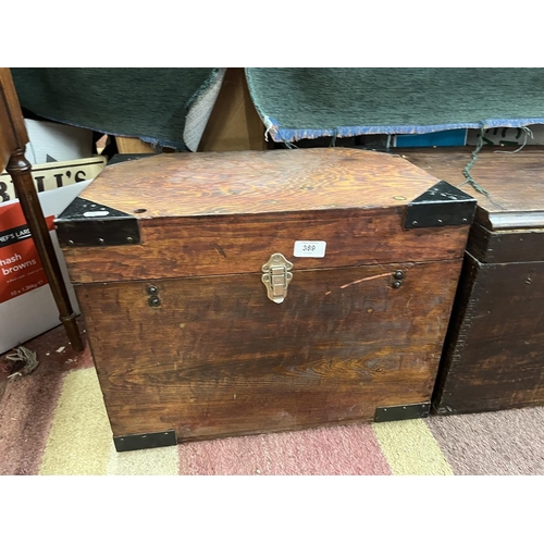 389 - 2 wooden chests, medium size, with metal corner brackets and steel swing handles, possibly ex-milita... 