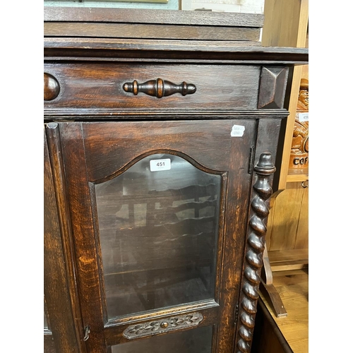 451 - Carved oak glazed bookcase