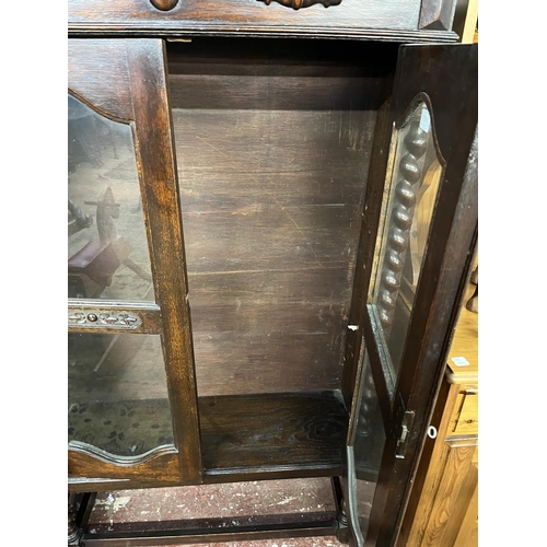 451 - Carved oak glazed bookcase