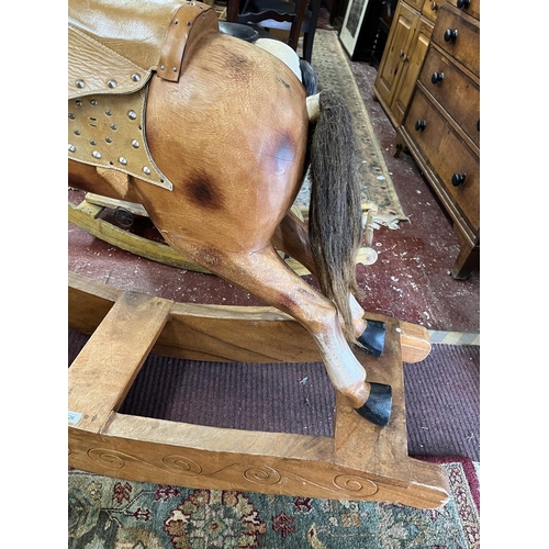 526 - Carved wooden rocking horse