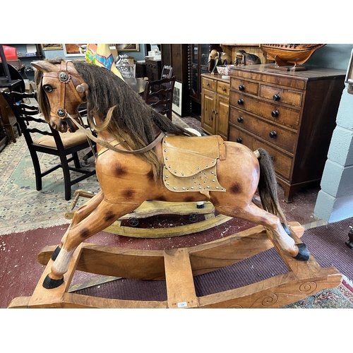 526 - Carved wooden rocking horse