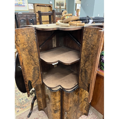 543 - Pair of burr walnut corner cupboards