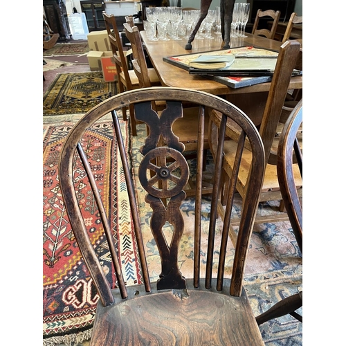 580 - Pair of antique wheel-back chairs with crinoline stretchers