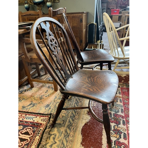 580 - Pair of antique wheel-back chairs with crinoline stretchers