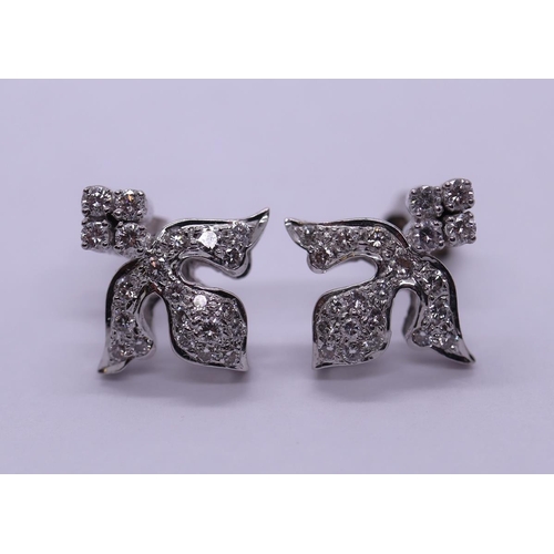 60 - Pair of 18ct white gold diamond set fleur de lys style earrings