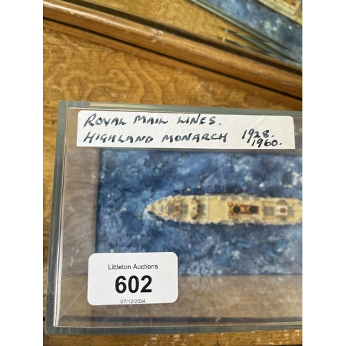 602 - 2 cased model naval ships