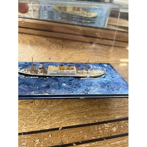 602 - 2 cased model naval ships