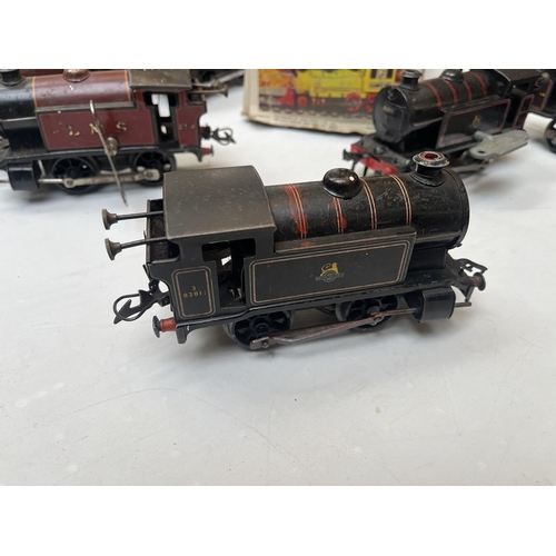 611 - Collection of black O gauge clockwork locomotives