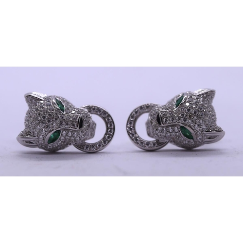 62 - Silver leopard stone set earrings