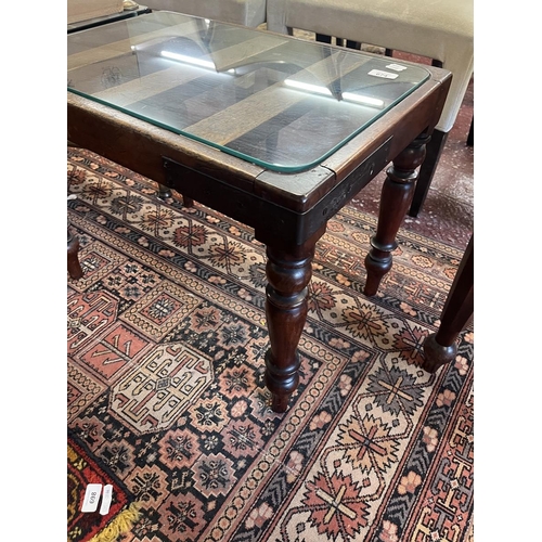 674 - Antique glass top coffee table