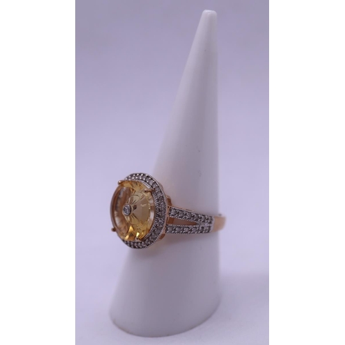 82 - 9ct gold unusual citreen & diamond set ring - Size O