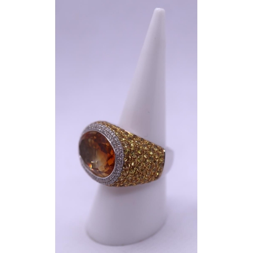 83 - Fine 18ct gold ring set with large citrine bordered by diamonds the shank set with yellow sapphires ... 