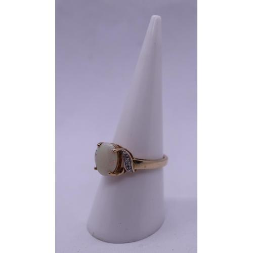 93 - 9ct gold opal set ring with diamond shoulders - Size N