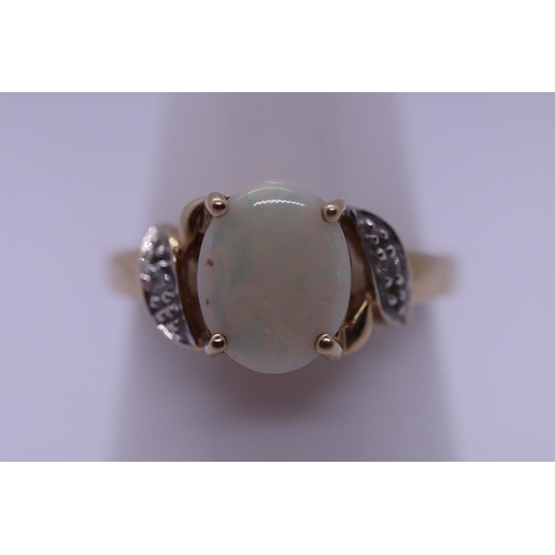 93 - 9ct gold opal set ring with diamond shoulders - Size N