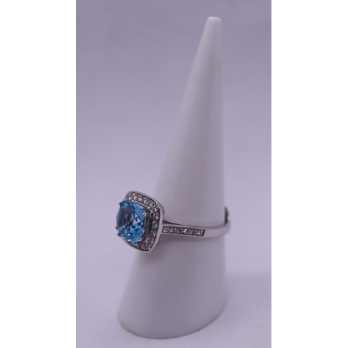 94 - 18ct white gold ring set with topaz & diamonds - Size N