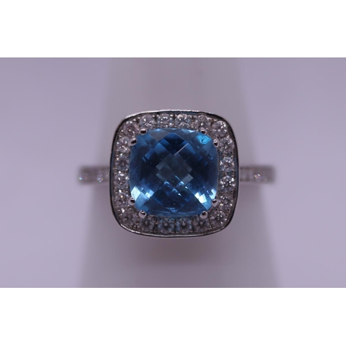 94 - 18ct white gold ring set with topaz & diamonds - Size N