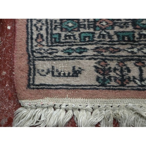 703 - Pakistan handwoven signed Bokhara pattern runner. 223cm x 80cm