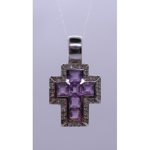 24 - White gold amethyst and diamond cross