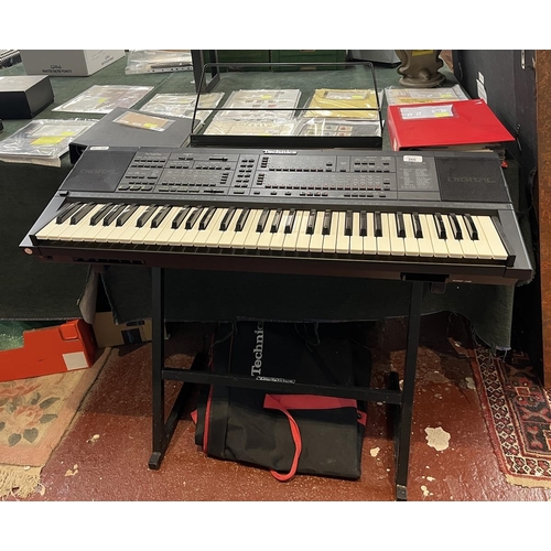 266 - Technics SX-K700 PMC electronic keyboard together with stand, foot pedal, carry case and book in goo... 