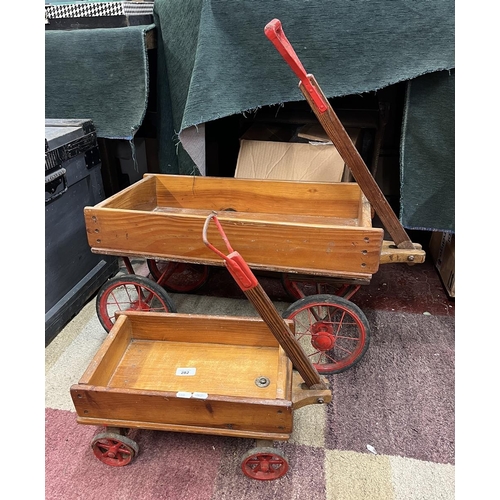 282 - Large and small pull along children's trollies