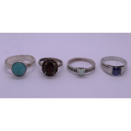 32 - 4 silver stone set rings