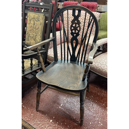 461 - Elm seated wheel back arm chair