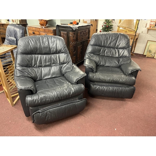 470 - Pair of leather swivel reclining armchairs