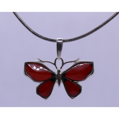 64 - Silver amber set butterfly pendent on silver chain