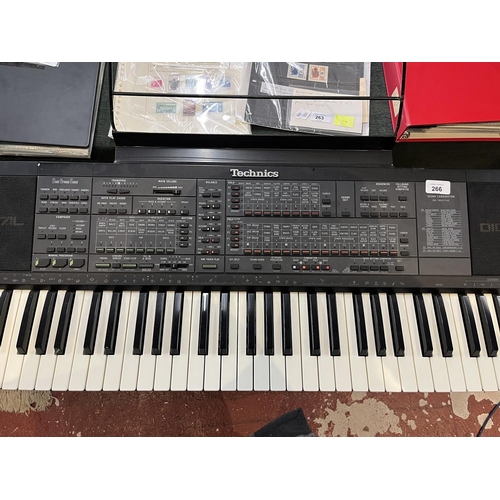 266 - Technics SX-K700 PMC electronic keyboard together with stand, foot pedal, carry case and book in goo... 