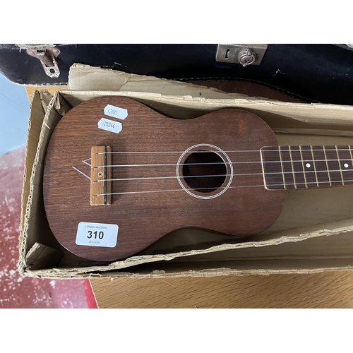 310 - Cased ukulele together with a child's guitar