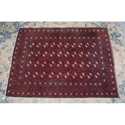 422 - Early 20thC tribal nomad, Afghan 'Bokhara' style, all wool, handwoven rug - Approx 210cm x 153cm